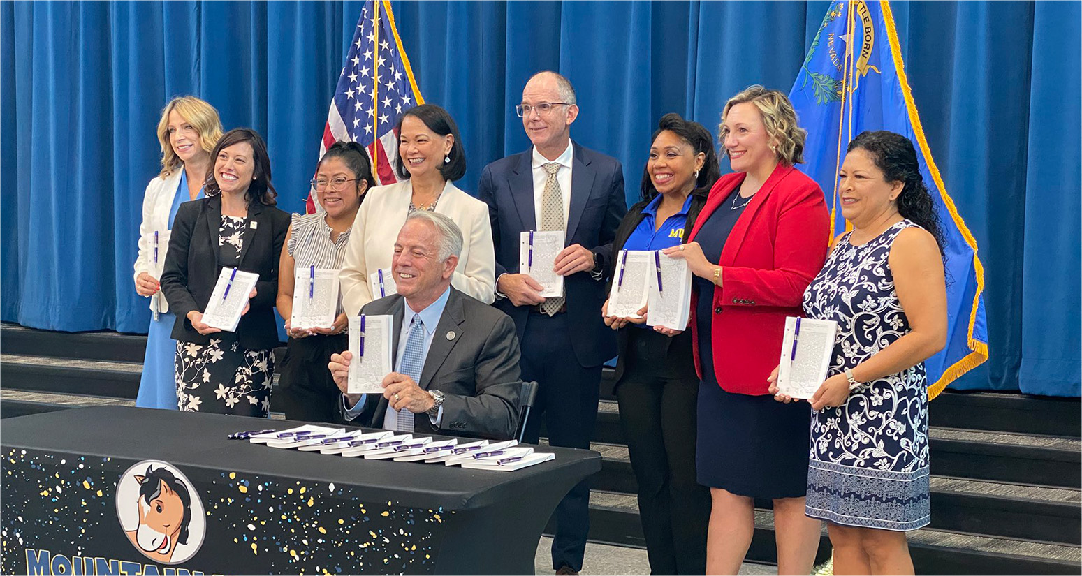 Governor Joe Lombardo signing legislation with local community leaders